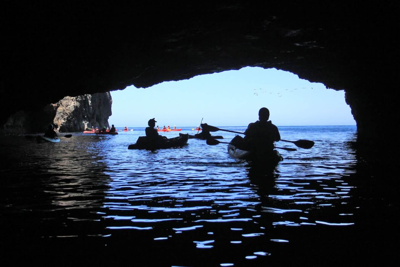 kayakers at the painted caves off the islands