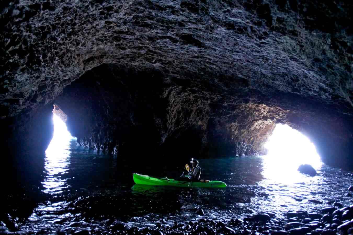 kayaker in the painted caves at the islands