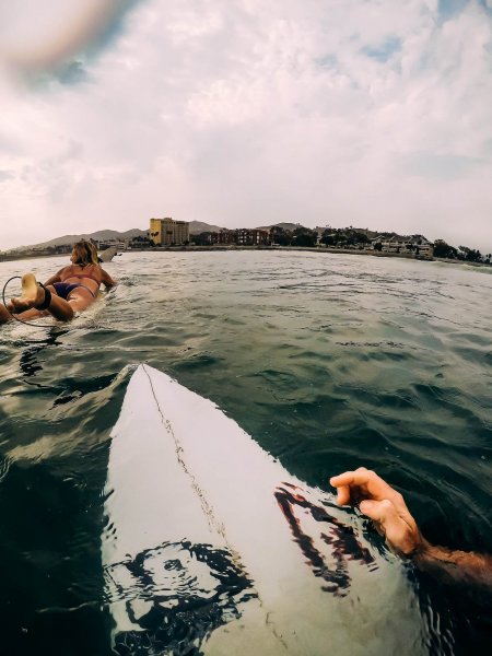 Surfing at Surfers Point with couple