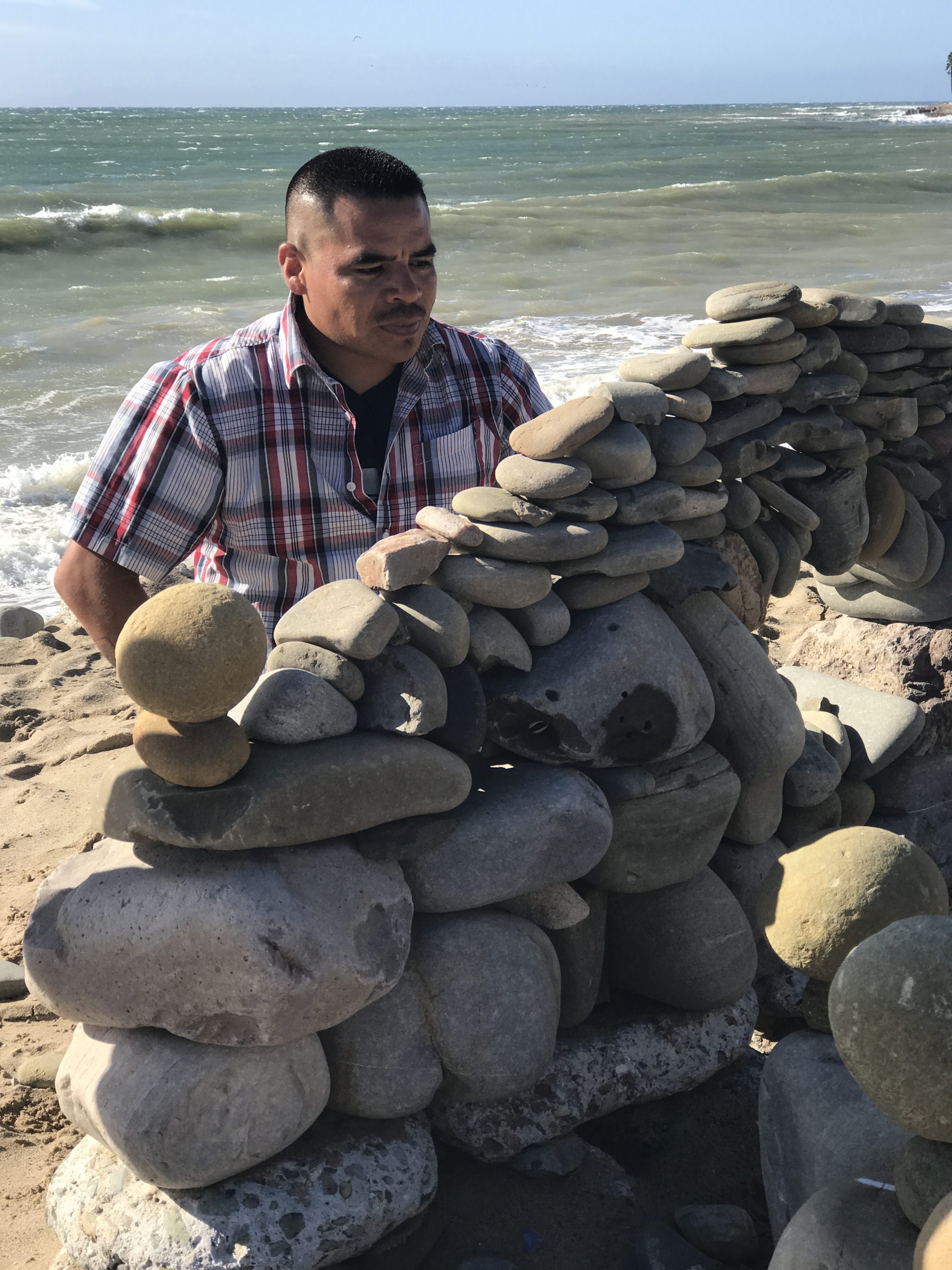 My name is Juan Manuel and I'm the man behind the stone art on Ventura beaches