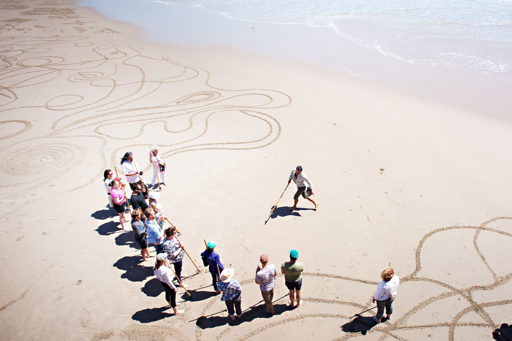 Andres Amador leads massive sand art project at Swami's Beach