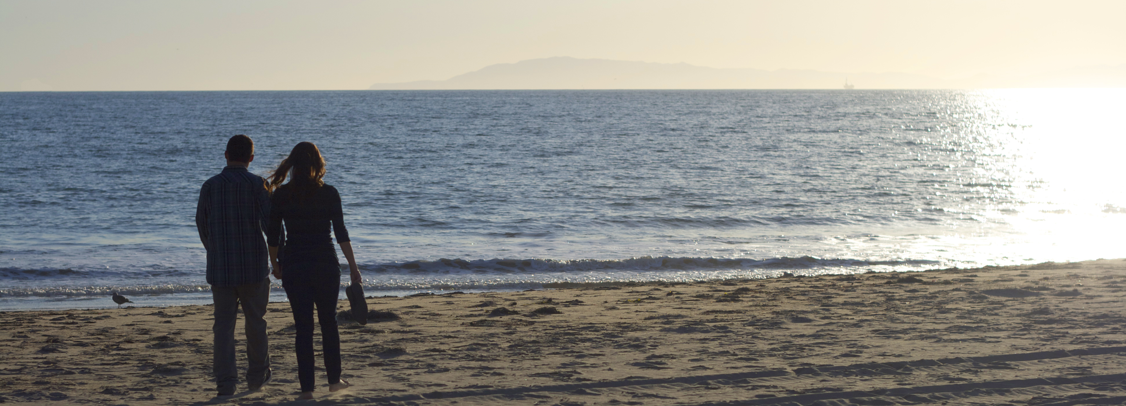 Lindsey and Jason Wilson walking Ventura Beach