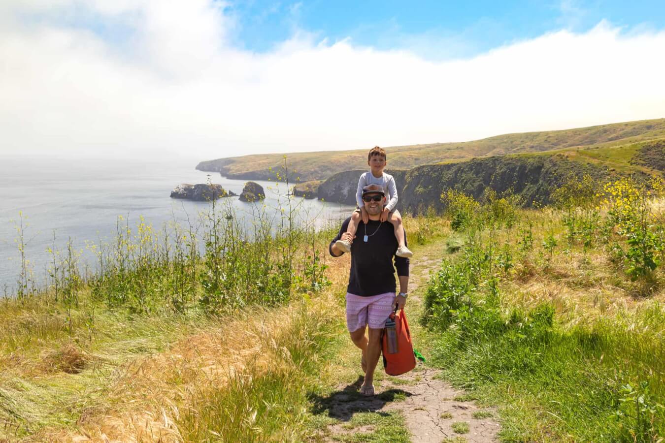 father and kid walking around the islands