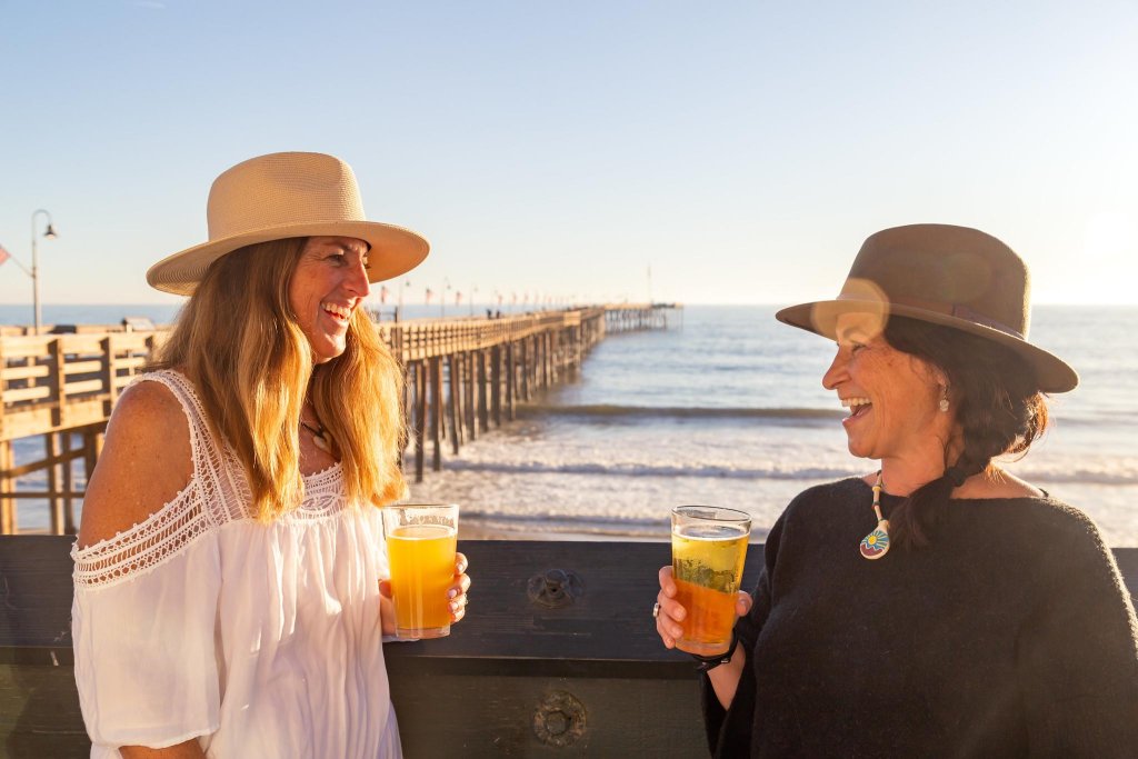 Marlyss and Kelly having a beer on the pier