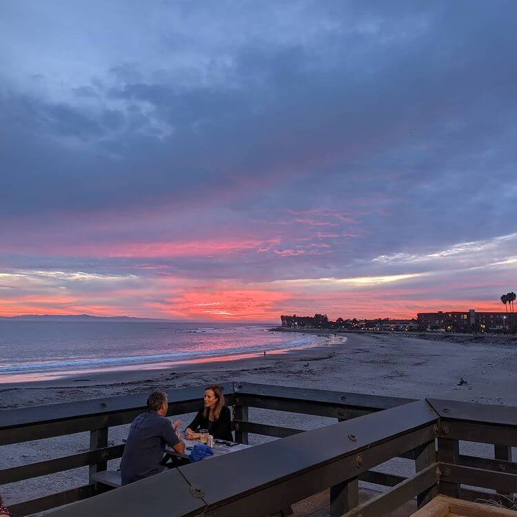 Couple at Eric Ericsson's restaurant at sunset