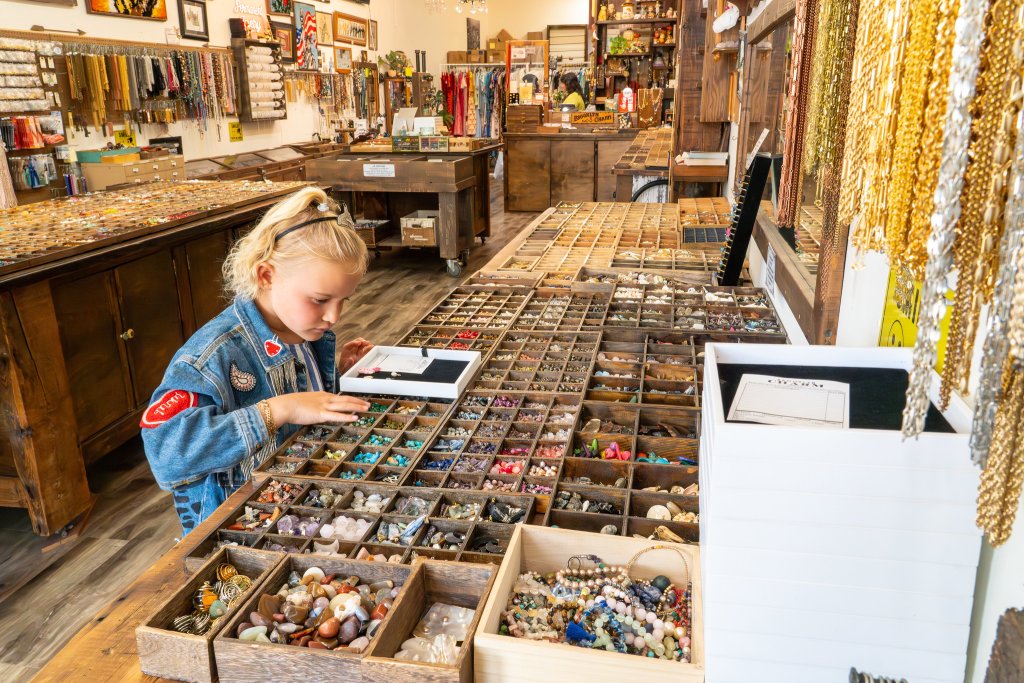 Young girl shopping in Downtown Ventura at Brooklyn Charm, a popular boutique store