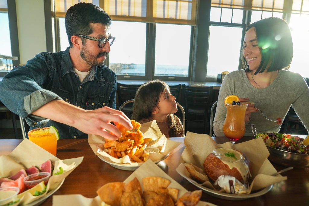 Family enjoying Eric Ericsson’s by the Ventura Pier