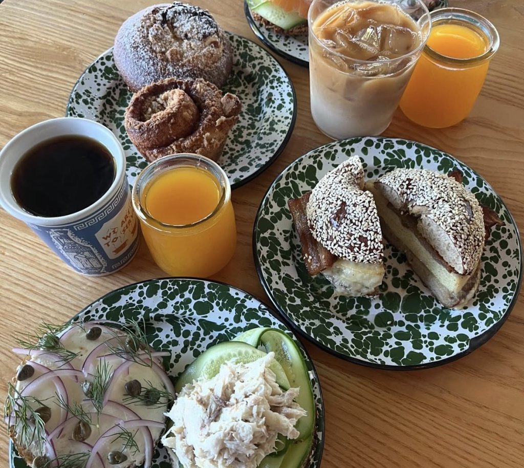 14 Cozy Restaurants with Cocktails and Comfort Food You Have to Try in Ventura plates full of bagels and cups of orange juice and coffee