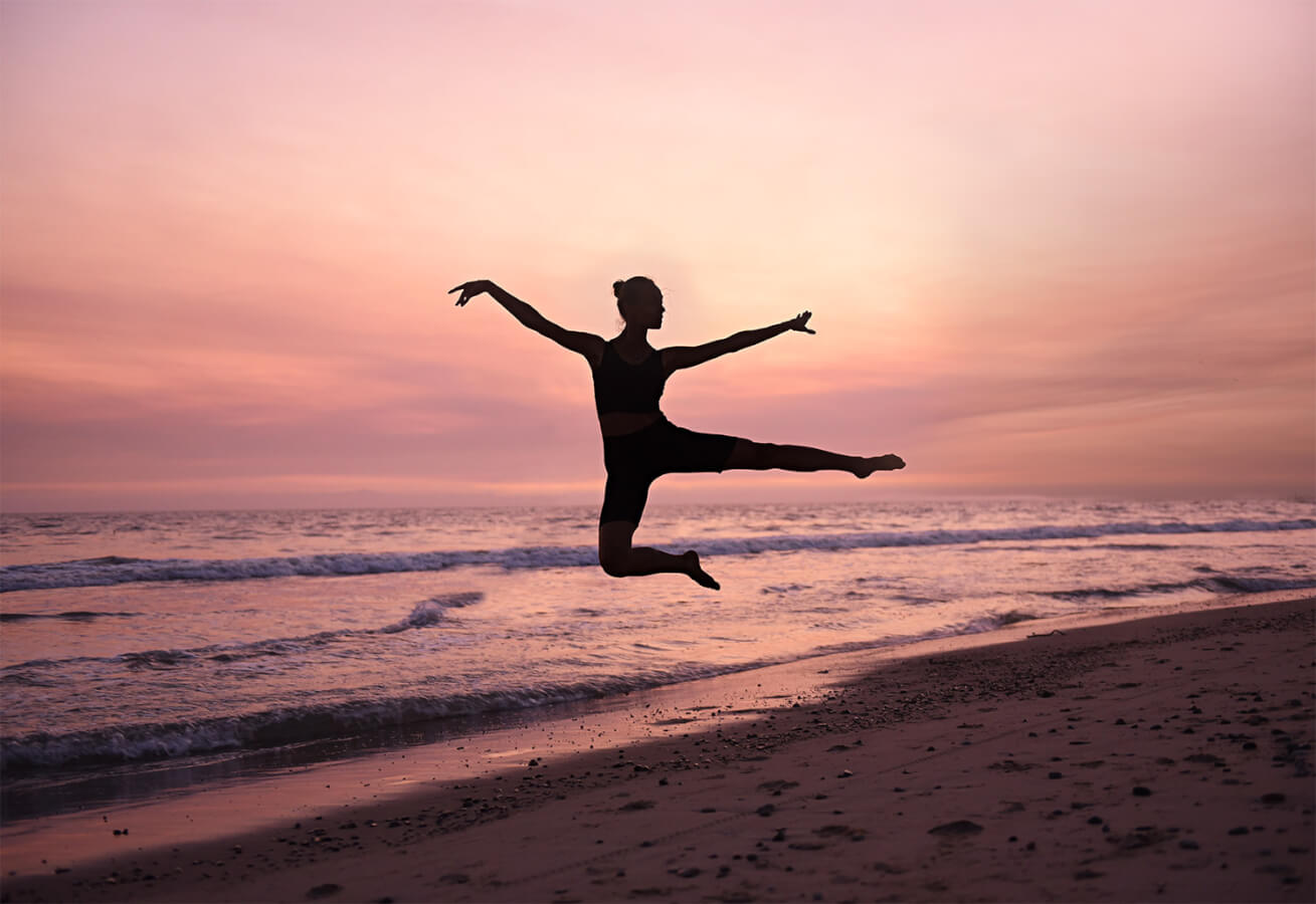 Dancer jumping on the beach