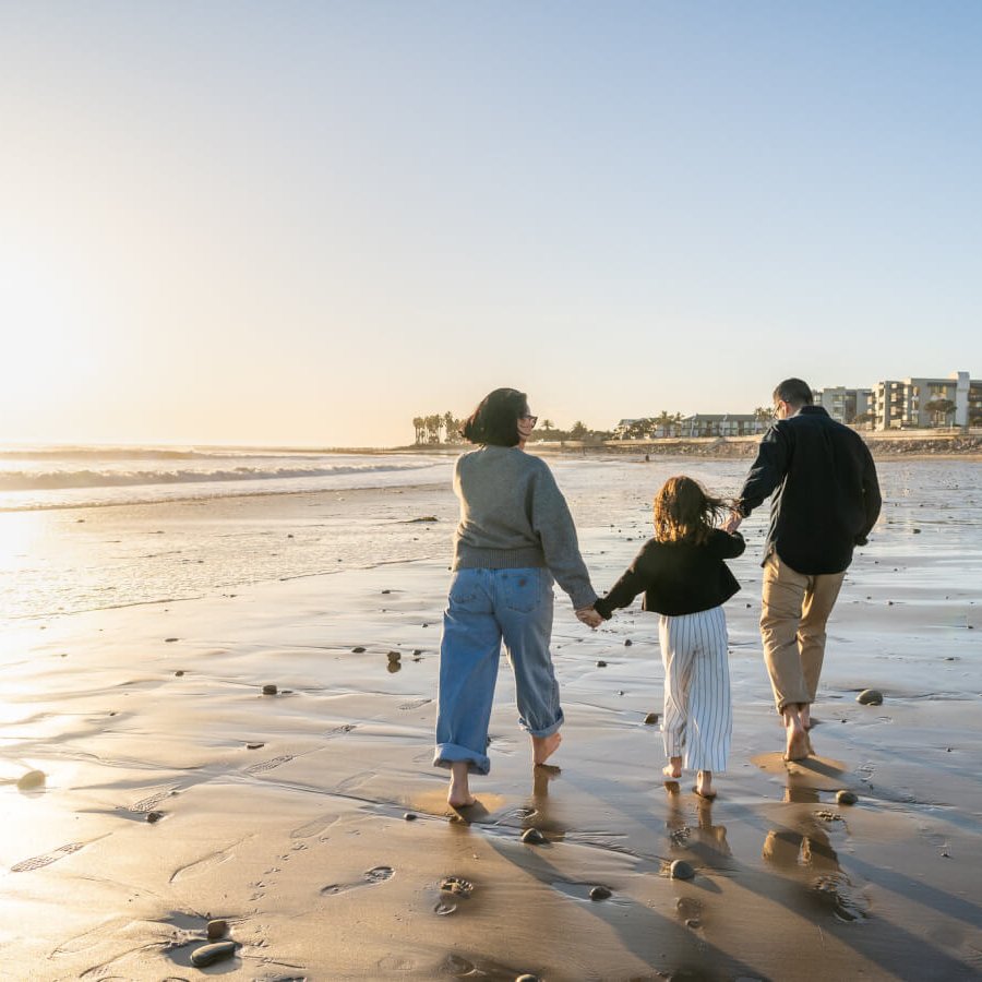 family walking at Ventura Pier beach