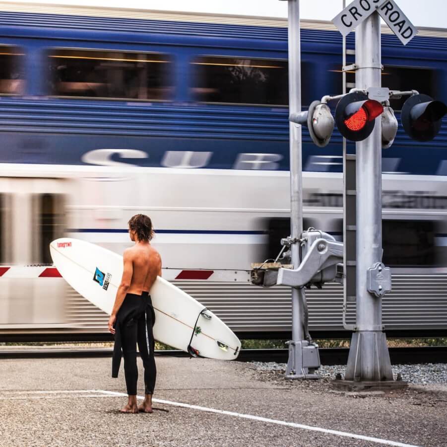 Thank You surfer in front of amtrak pacific surfliner train